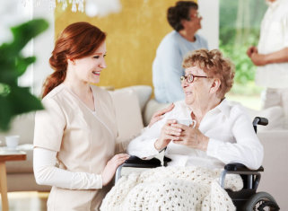 happy senior woman with her caregiver