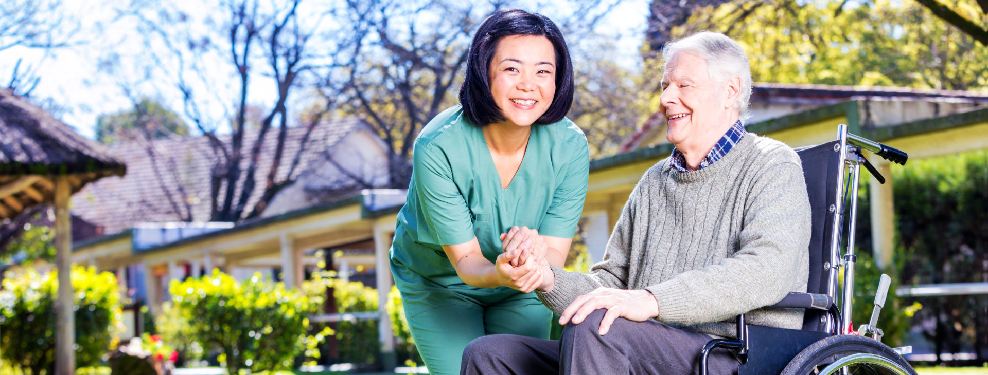 senior man on wheelchair with his caregiver